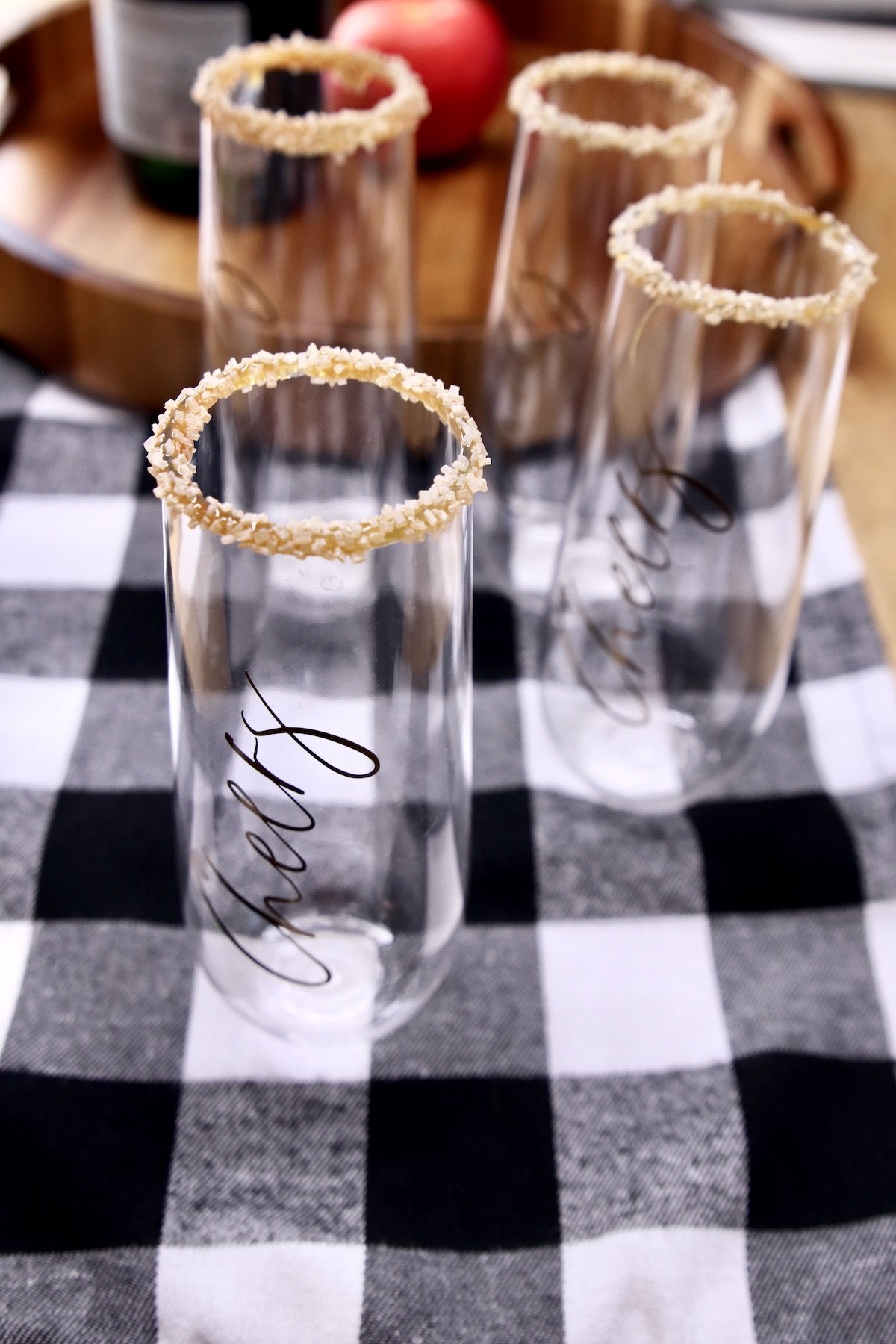caramel sugar garnished rim champagne glasses
