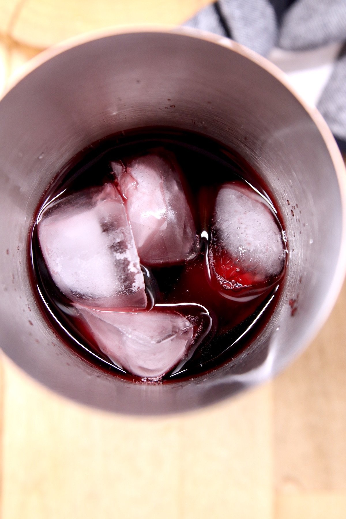 making wine cocktail in shaker with ice
