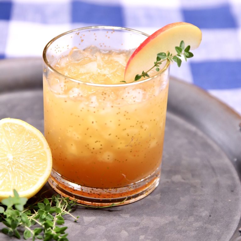 Apple Amaretto Sour Cocktail with apple slice garnish