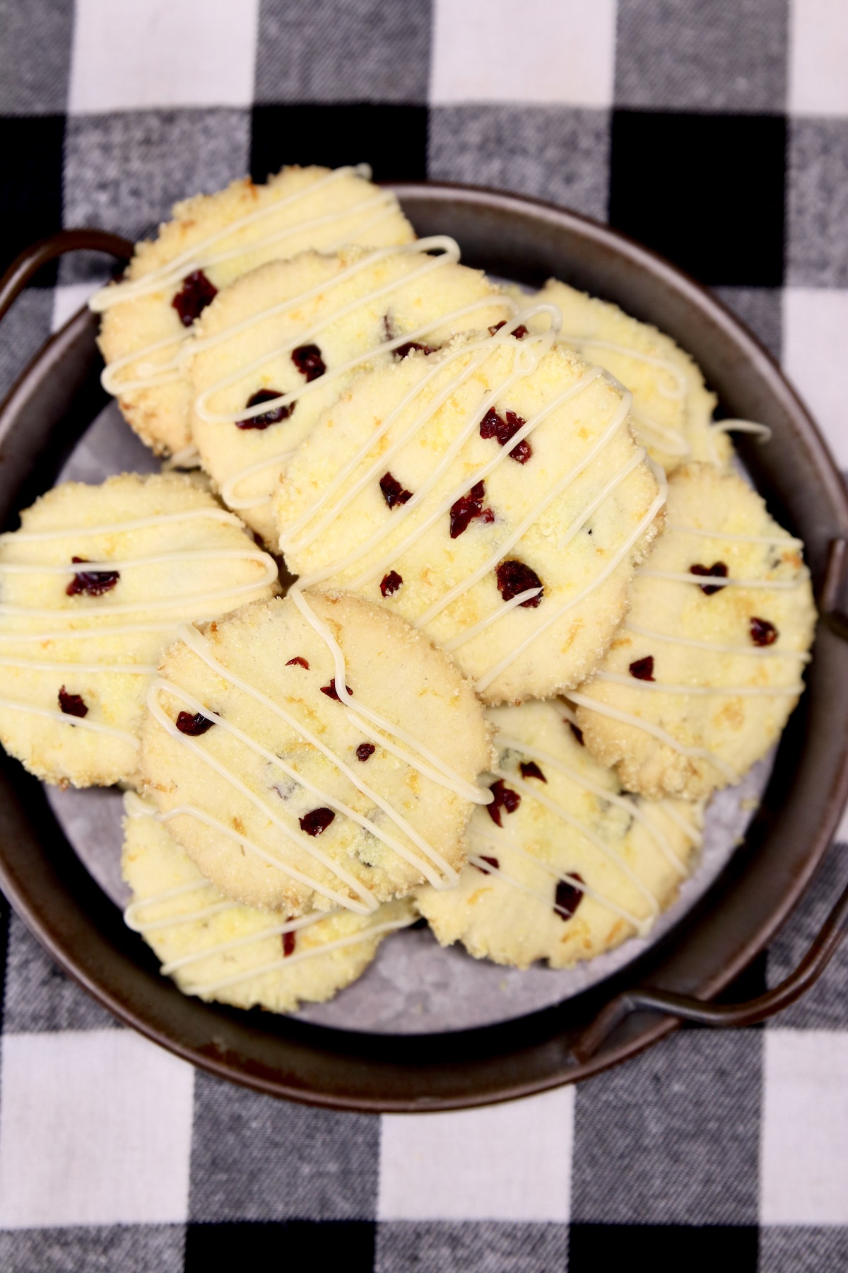platter of cranberry cookies on a buffalo check napkin