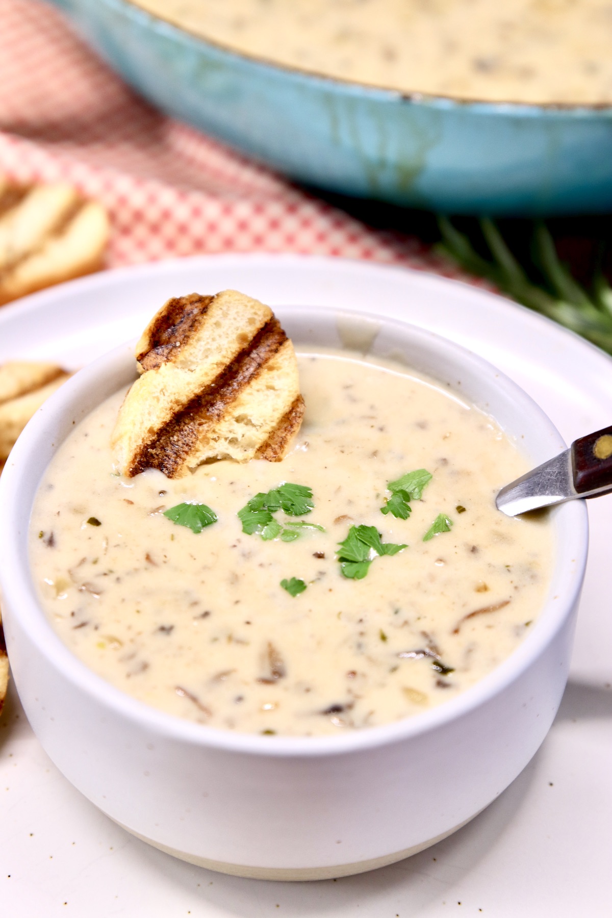 bowl of cream of mushroom soup with toast slice