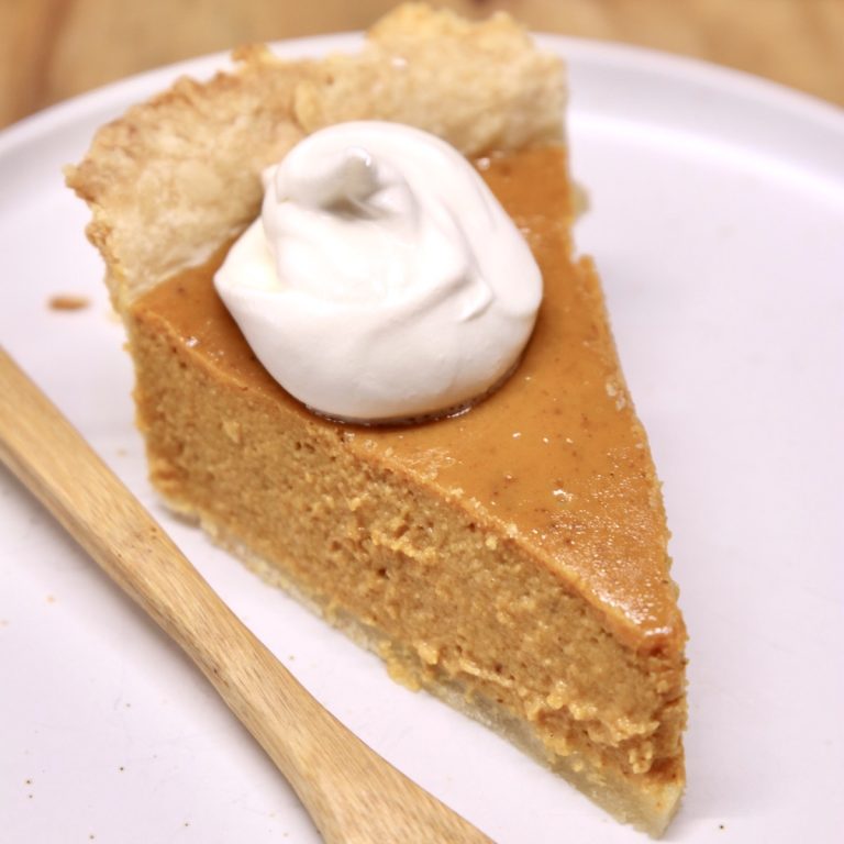 pumpkin pie slice with whipped cream