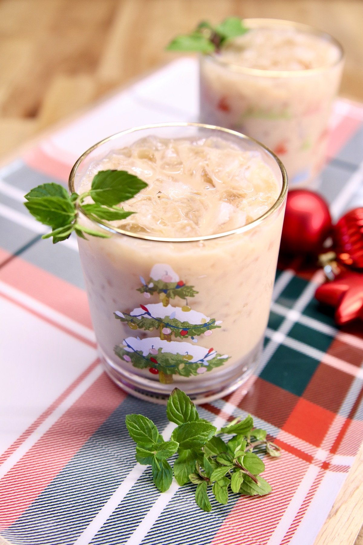 peppermint mudslide cocktails in 2 glasses on a plaid tray