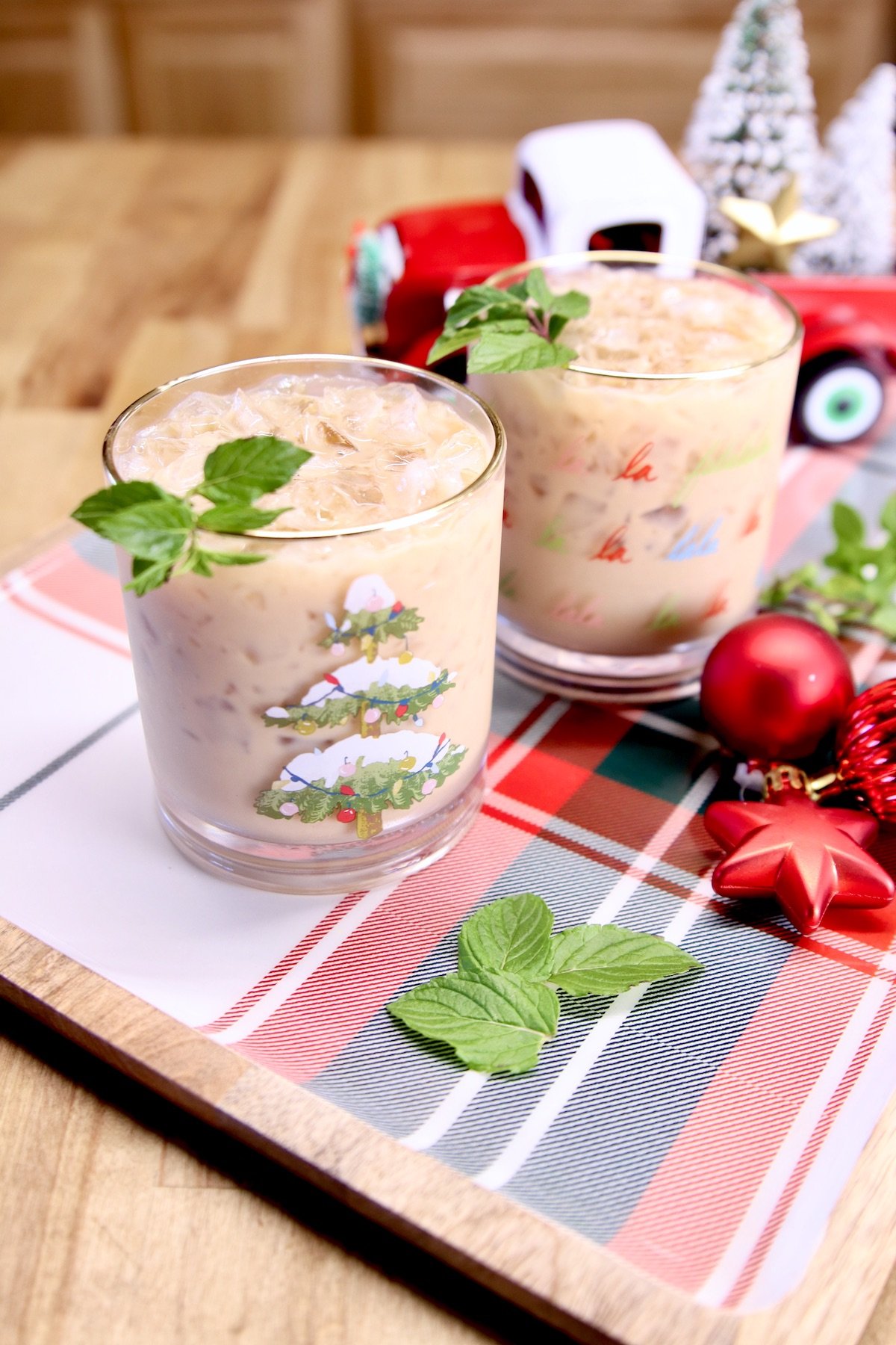 peppermint cocktails on a gray - Christmas truck in background