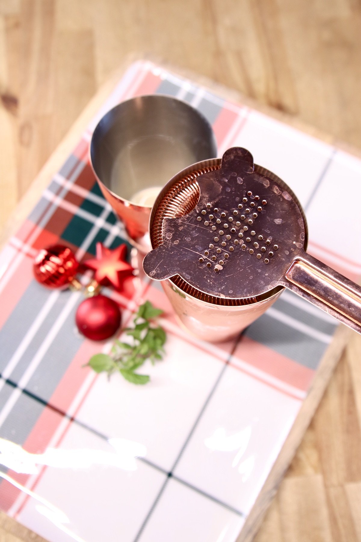 strainer on top of cocktail shaker