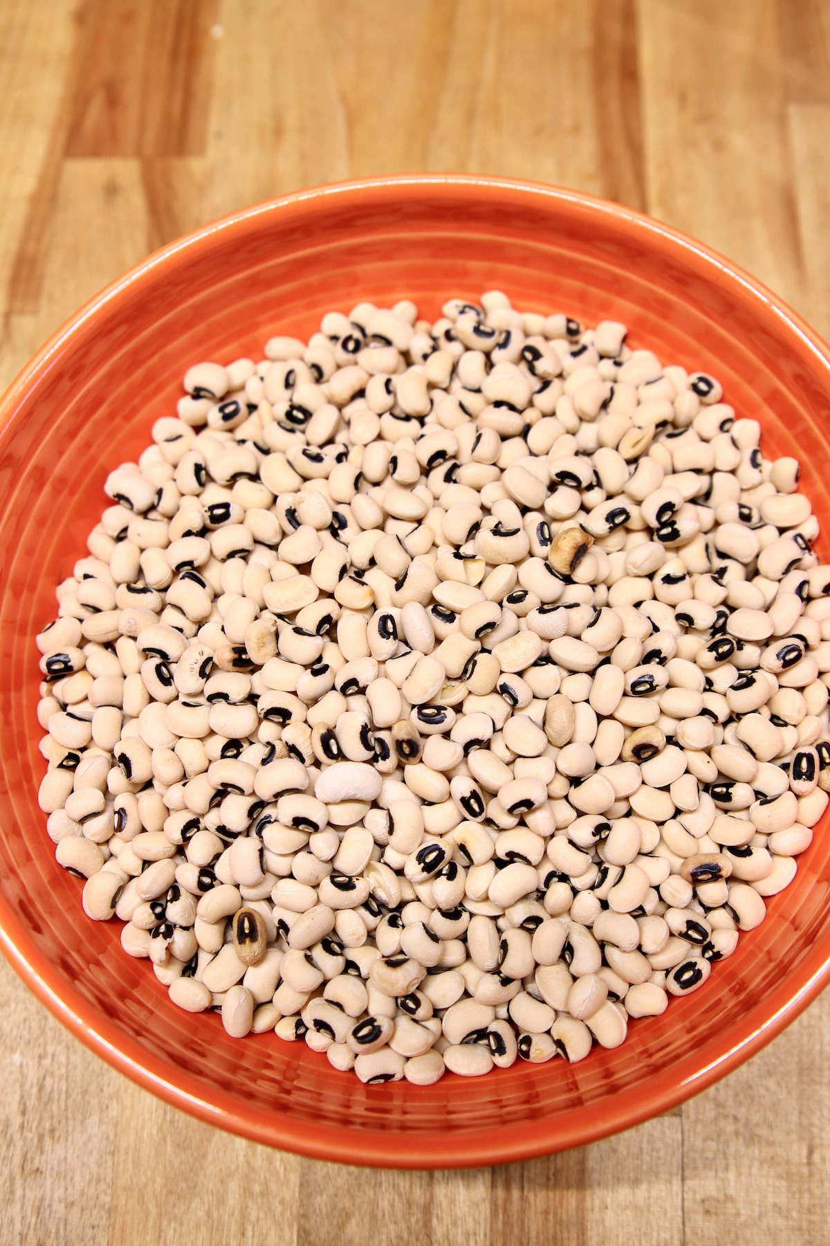 black eyed peas on an orange bowl