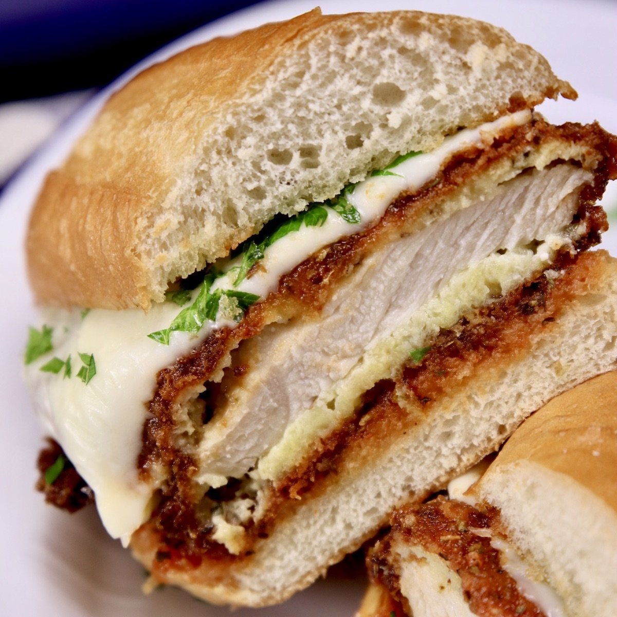 chicken parmesan sandwich cut in half - close up