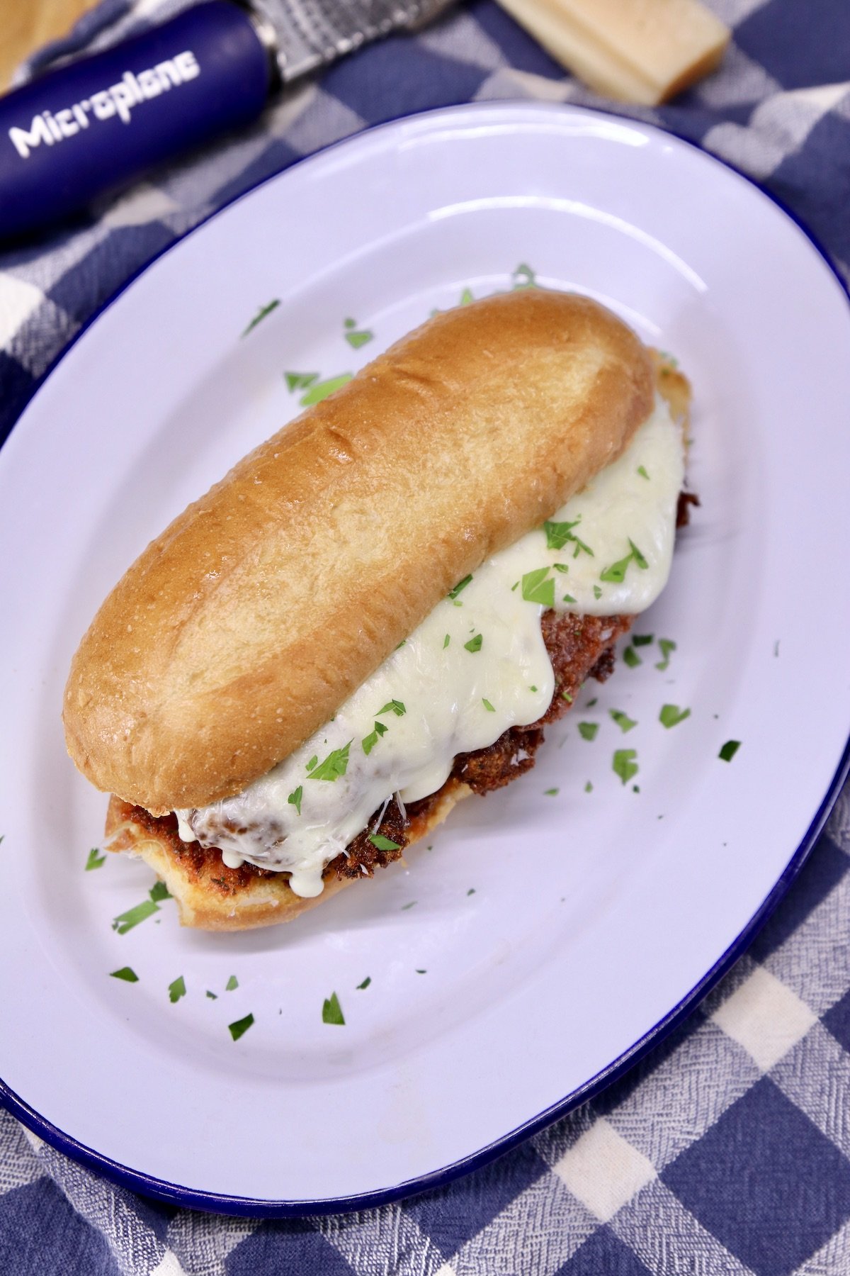 chicken parmesan sandwich on an oval platter