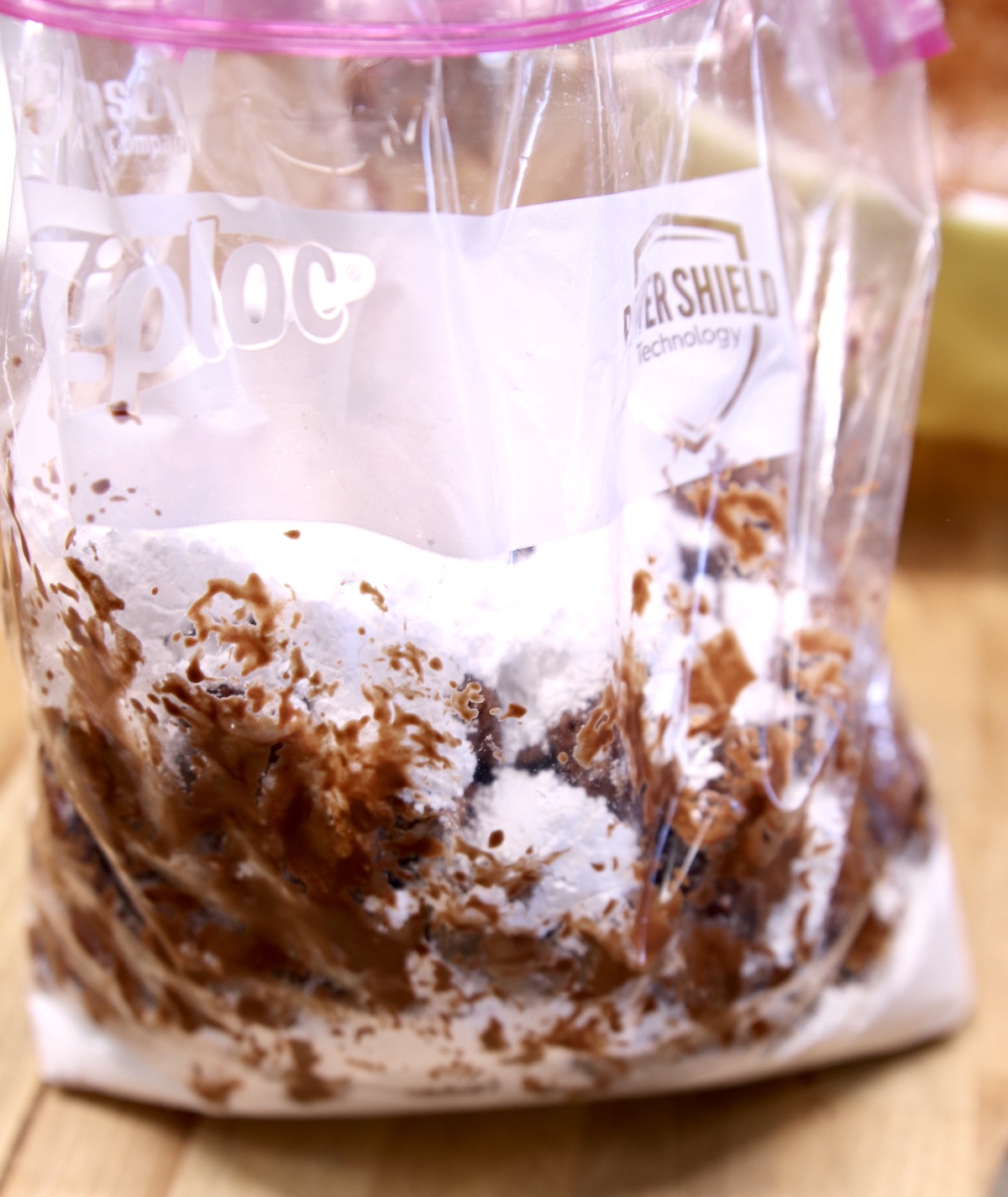 making muddy buddies in a zip top bag