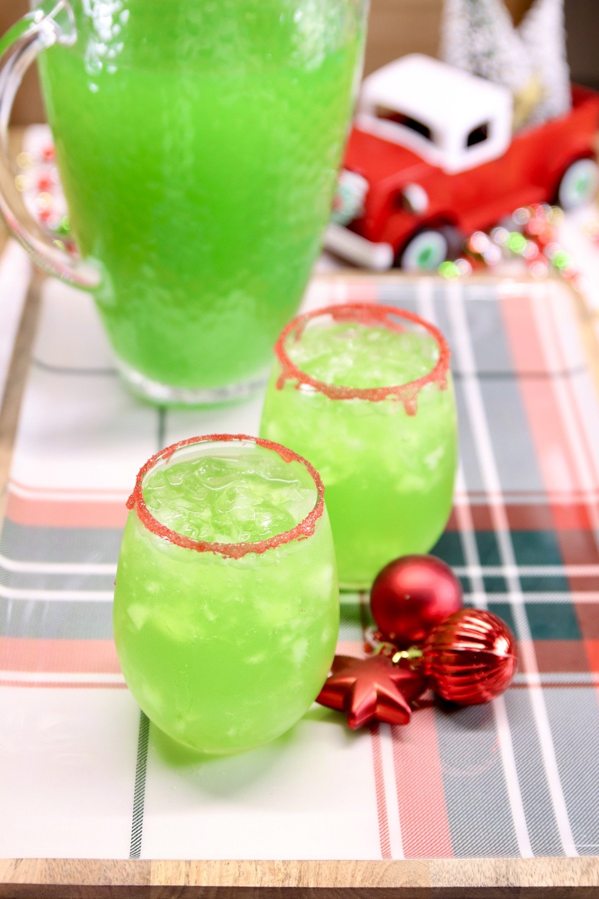 pitcher and 2 glasses of grinch punch