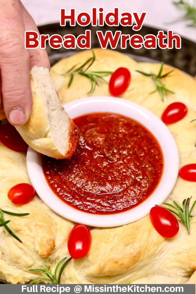 holiday bread wreath dipping into marinara sauce