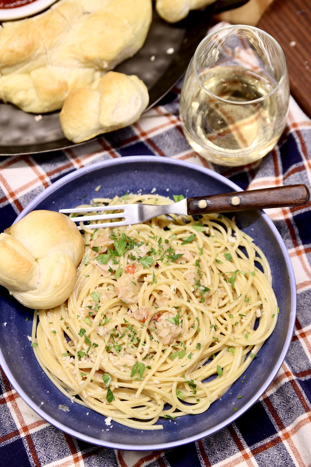 bowl of clam sauce over spaghetti