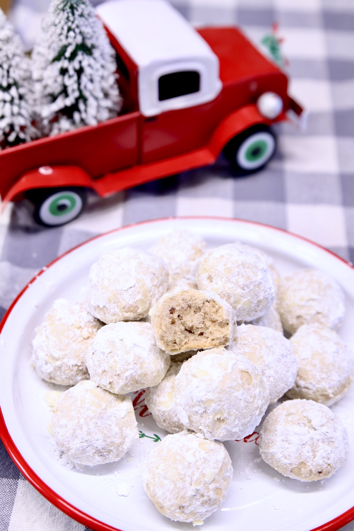 Snowball cookies on a tray -Christmas truck in background