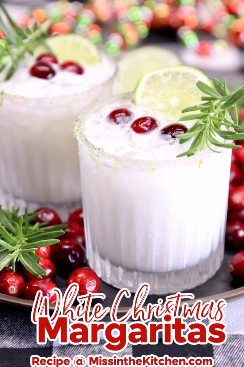 Coconut margaritas with cranberry and rosemary garnish.