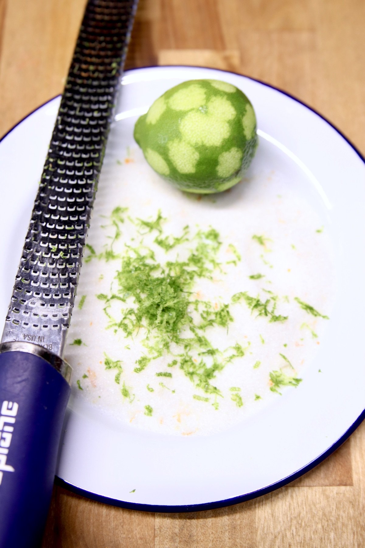 saucer with sugar and lime zest