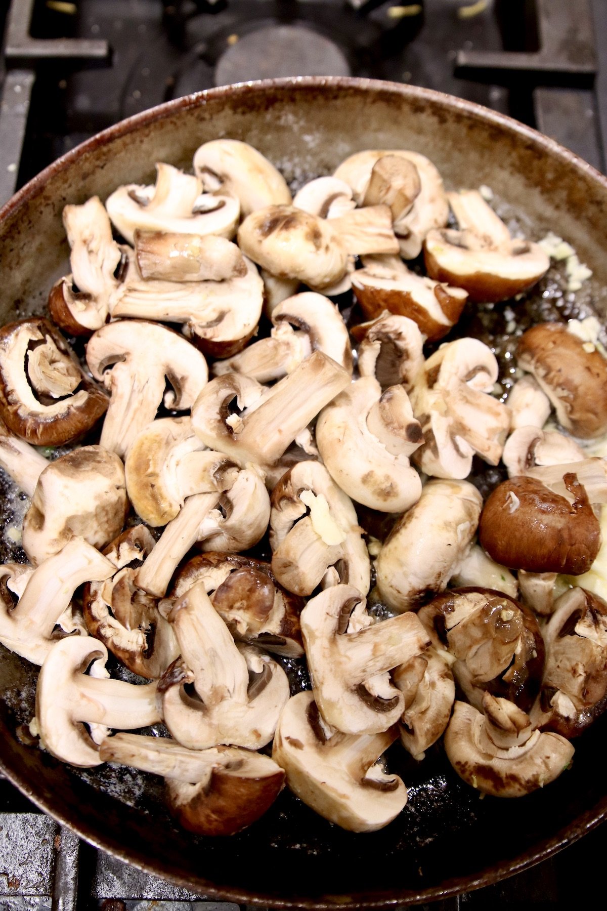 sliced mushrooms in a skillet