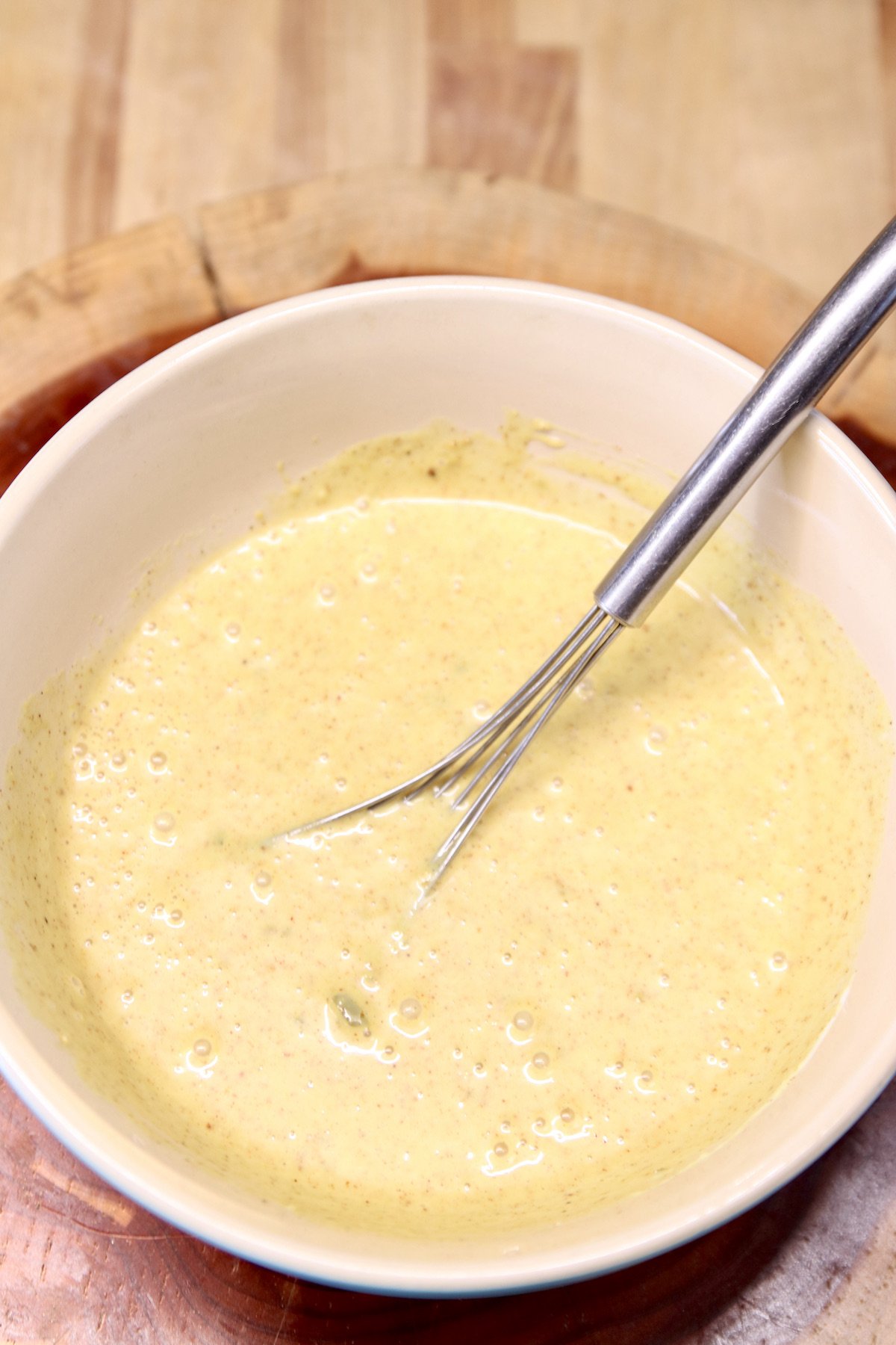 bowl and whisk with jalapeno honey mustard