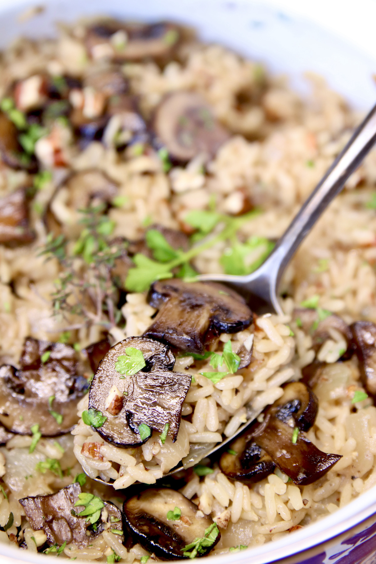 mushroom rice - spoonful in a pan