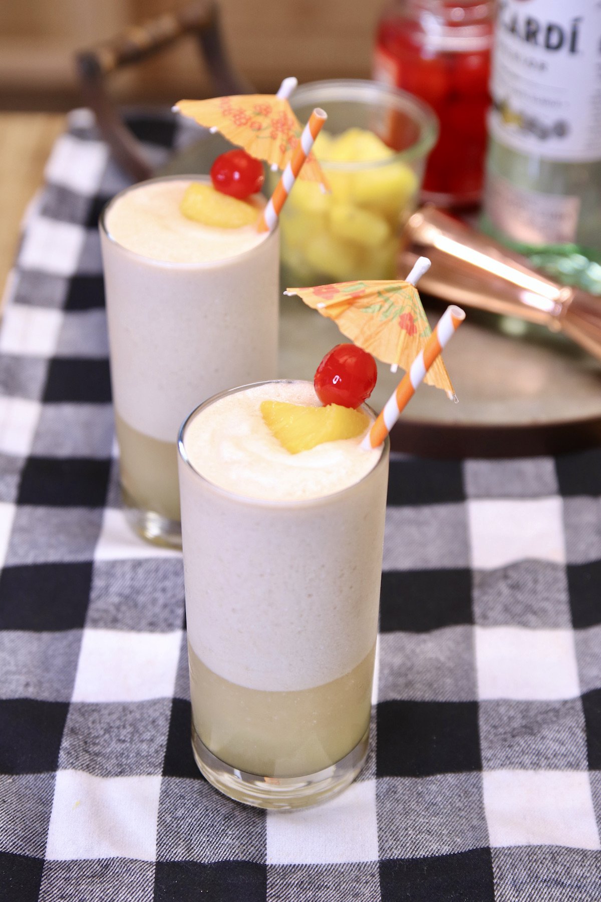 rocket fuel cocktails with cherry and pineapple garnish.