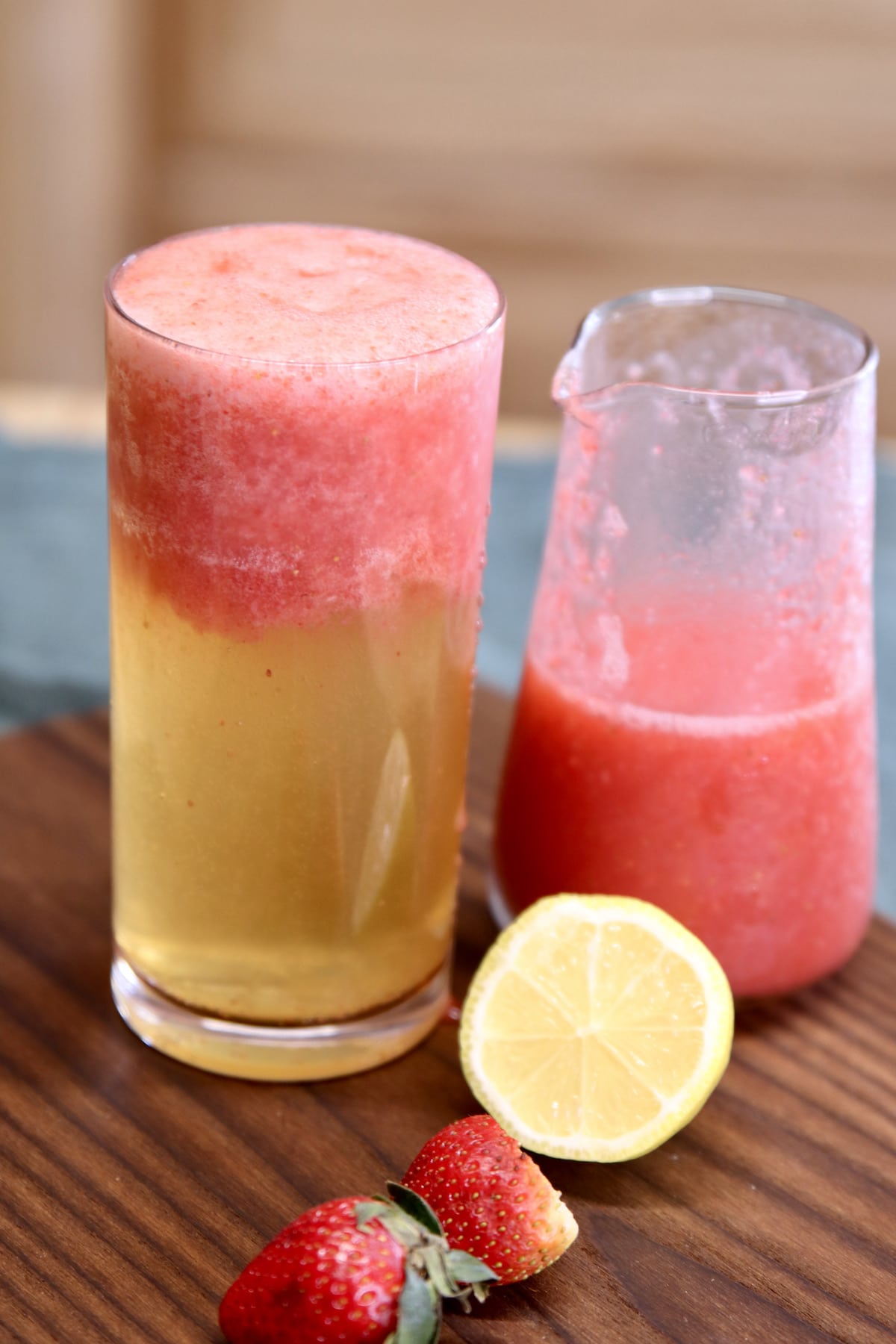 glass of beer with blended strawberries.