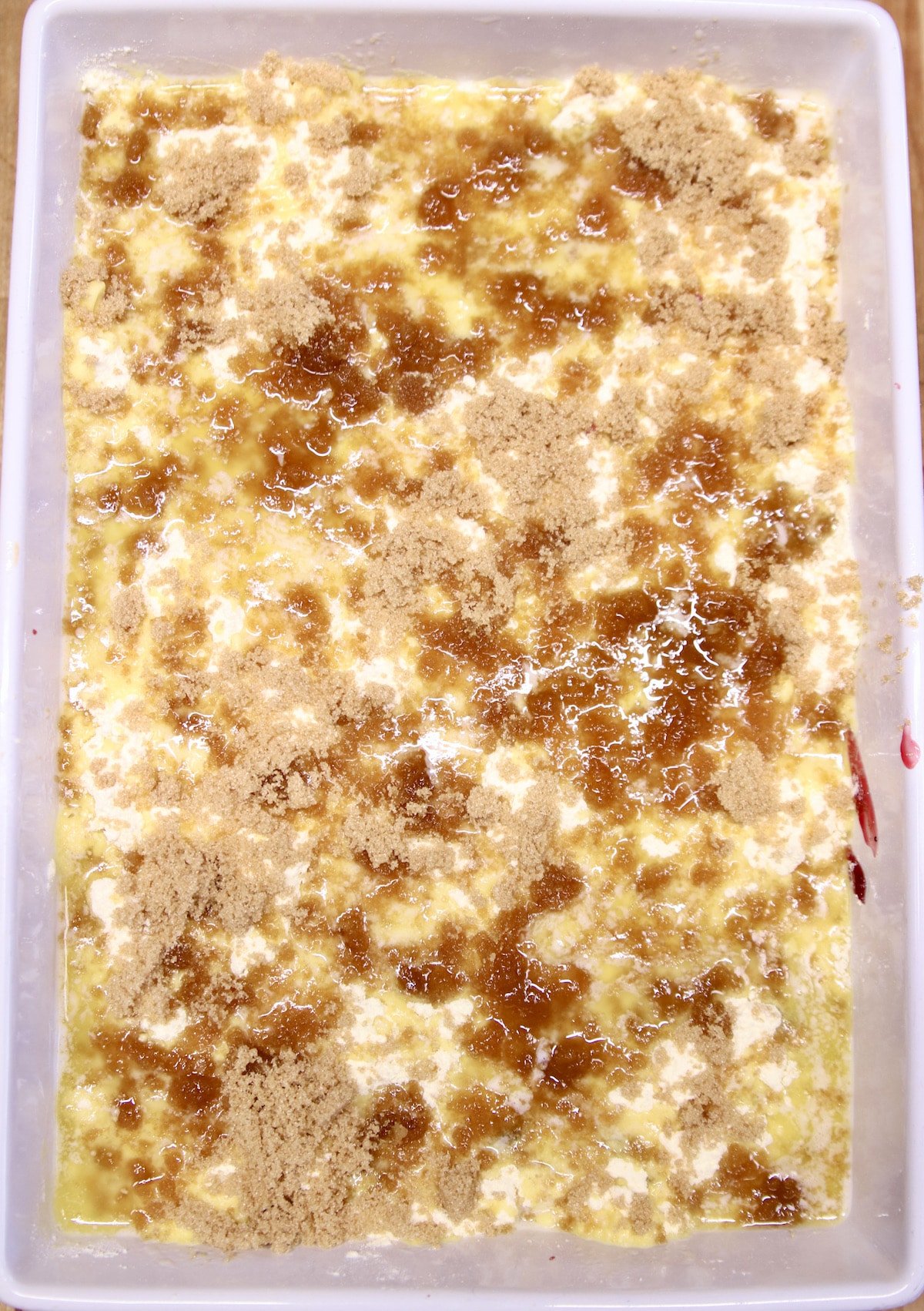 Brown sugar sprinkled over unbaked dump cake.