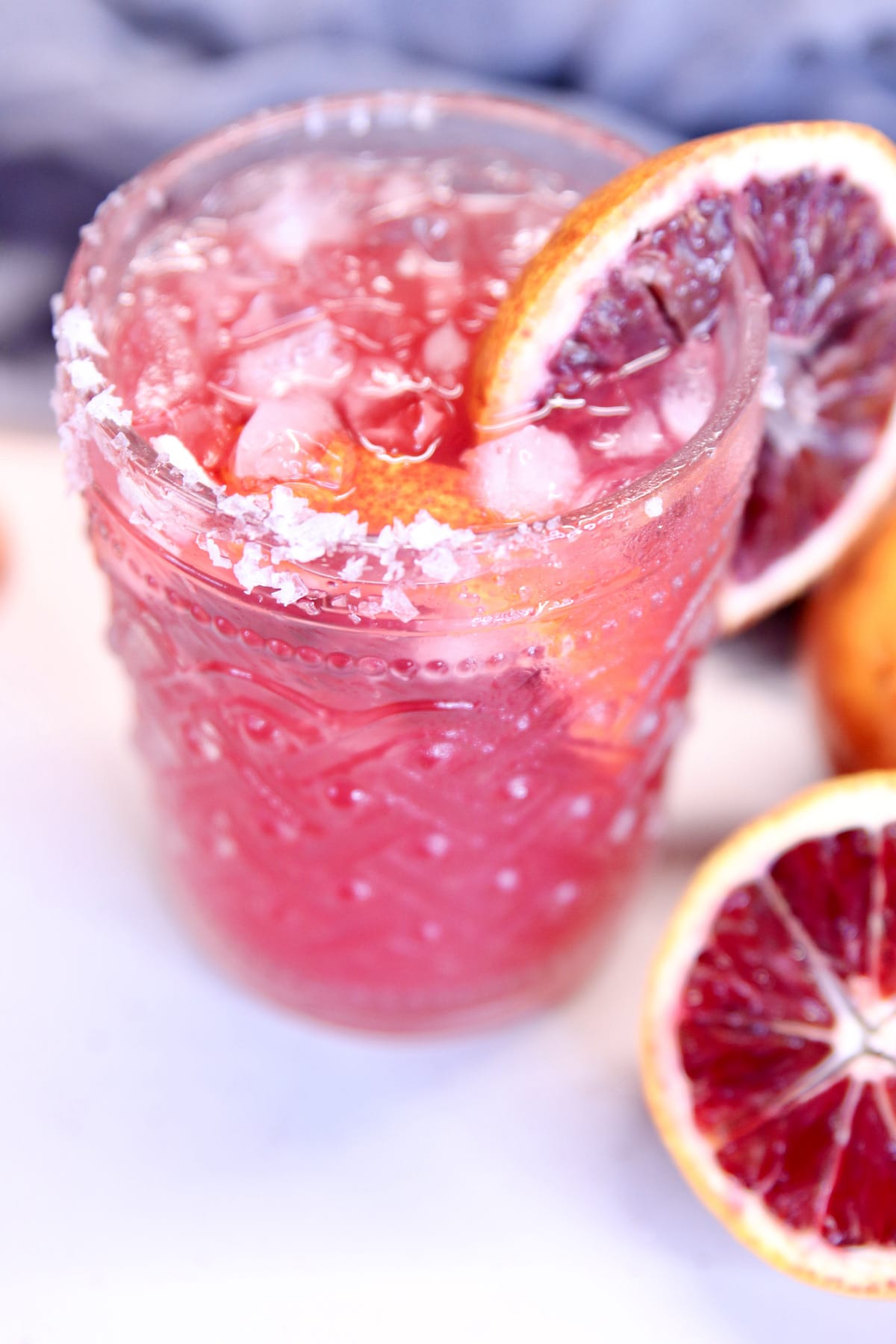 Blood orange margarita with salted rim.