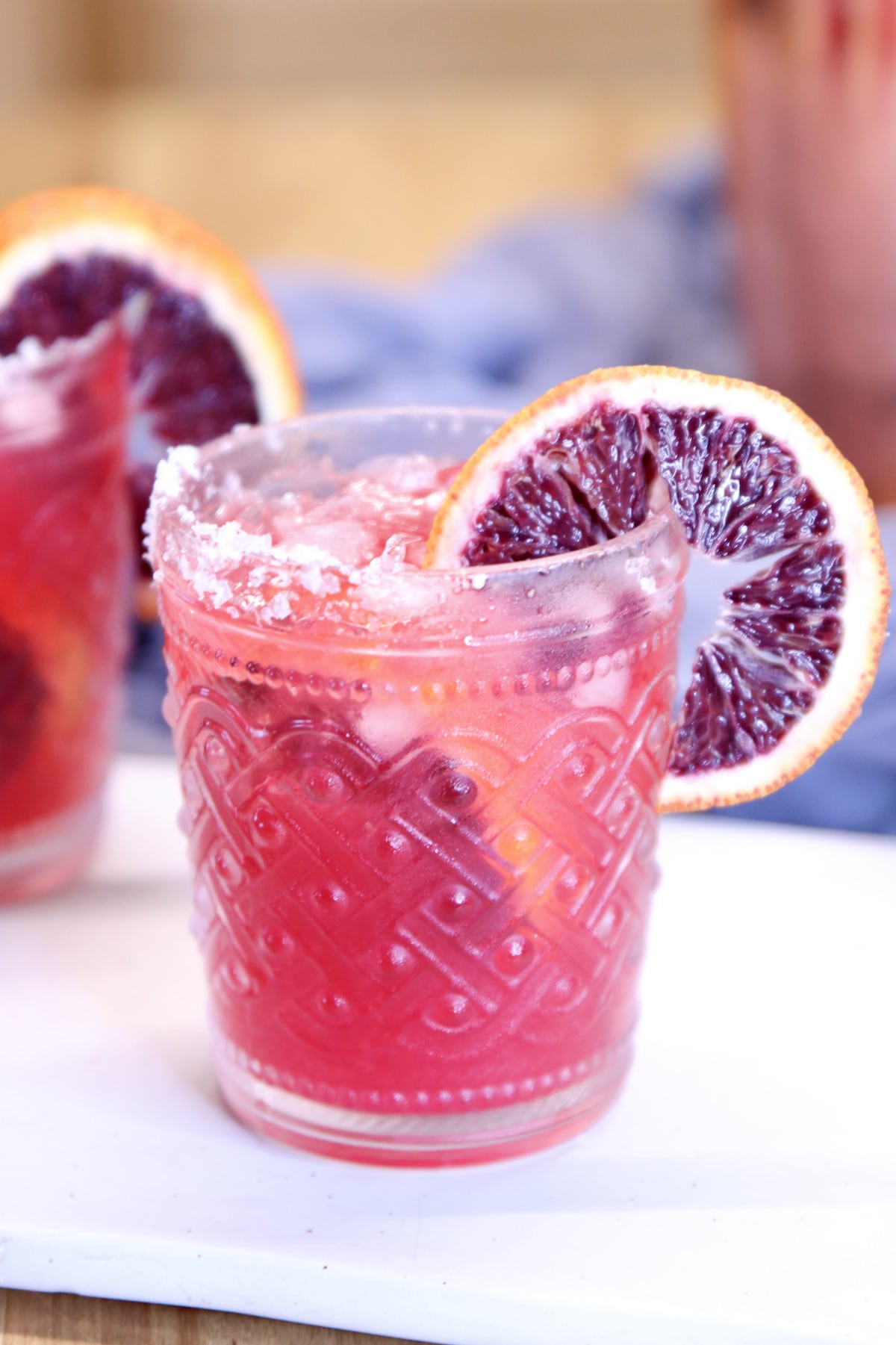 Blood Orange Margarita with orange wheel garnish.