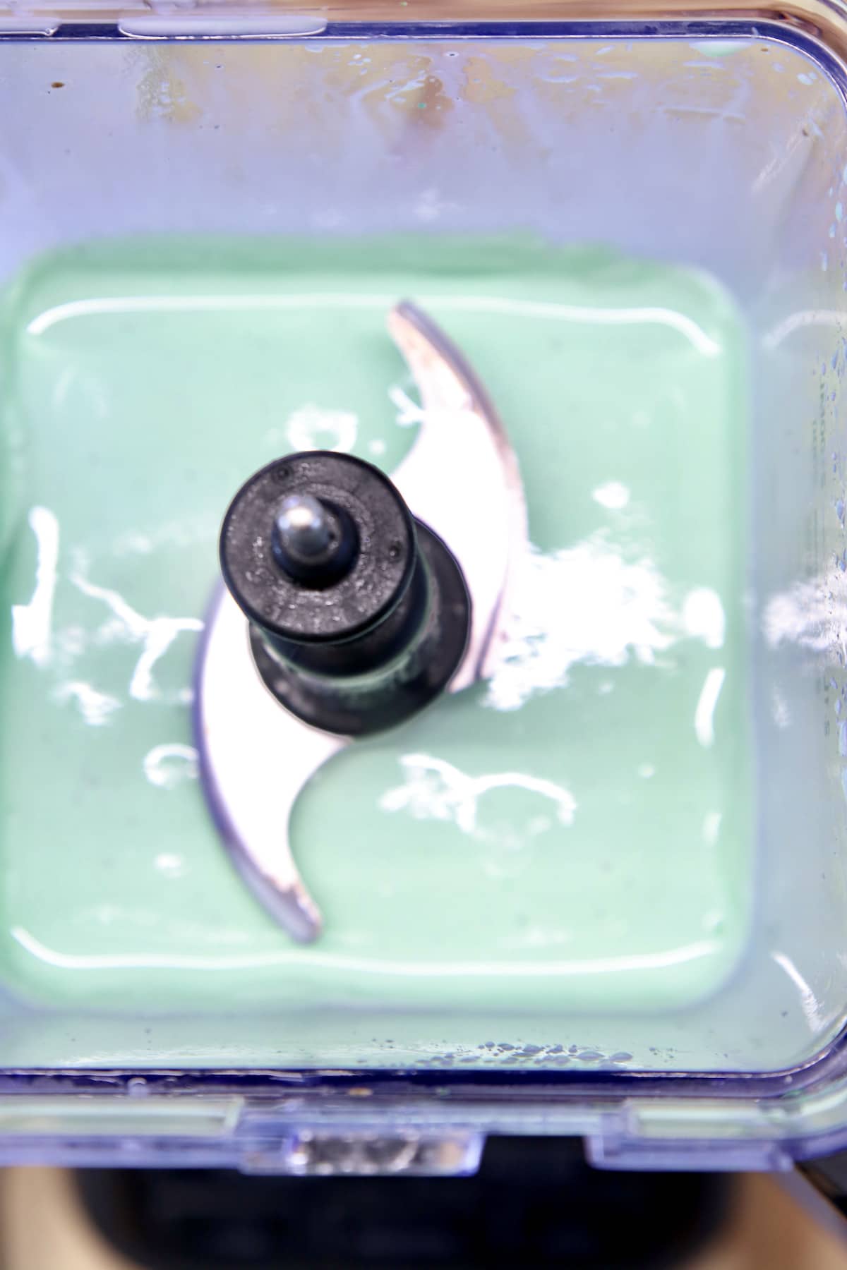 Mint milkshakes in blender - top view.