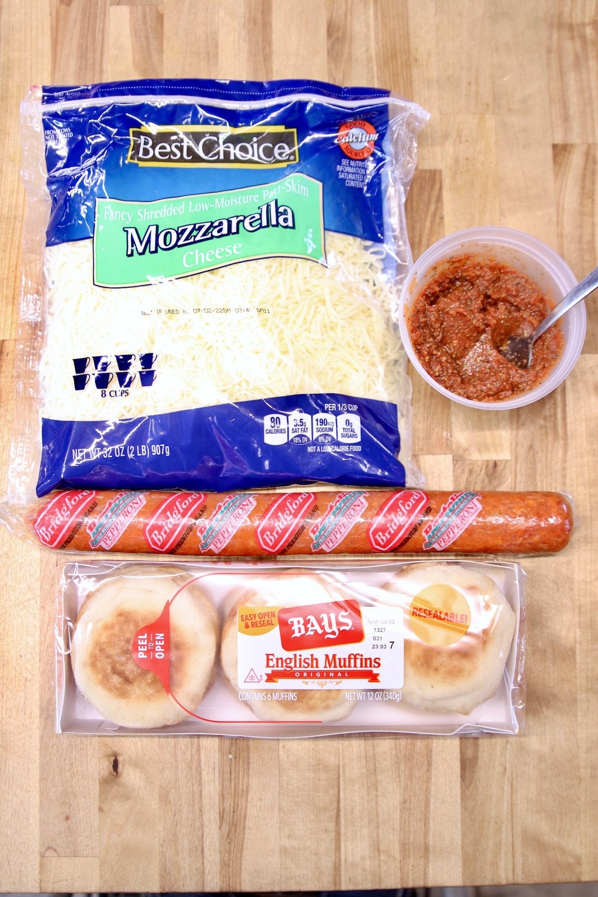 Mozzarella cheese, pizza sauce, pepperoni stick, English muffins.