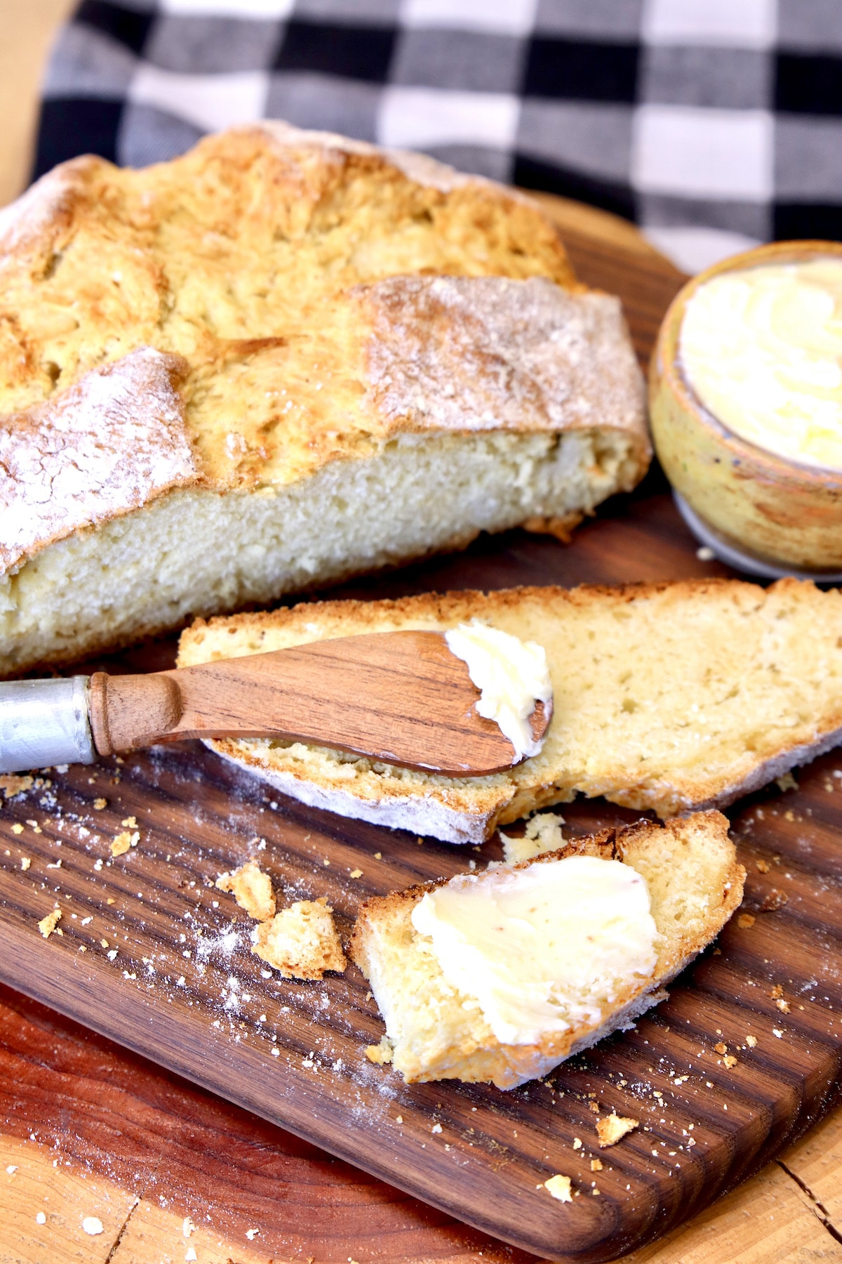 Irish Bread Sliced on a board with butter.