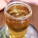 jar of smoked simple syrup with rosemary.