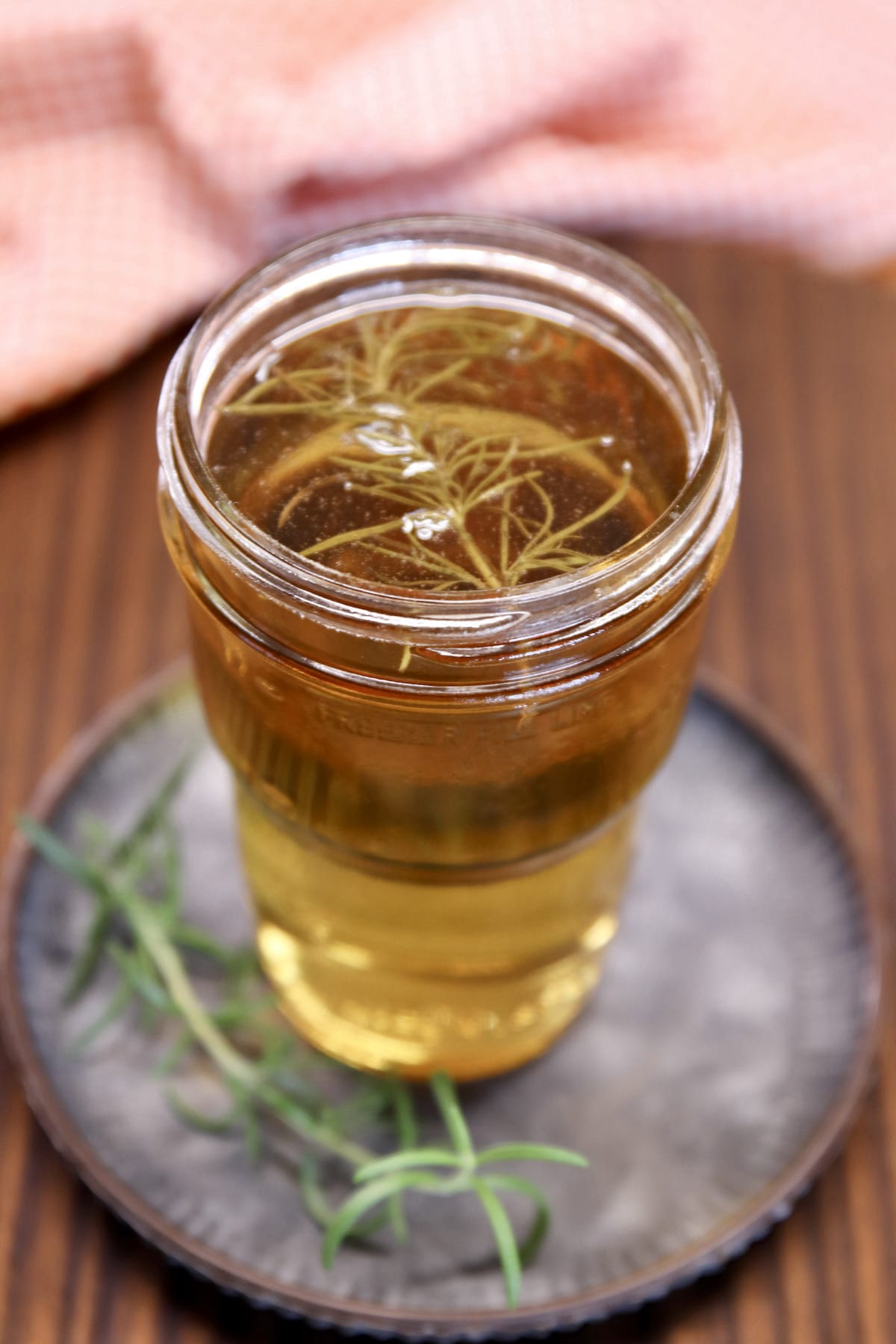 jar of smoked rosemary simple syrup.