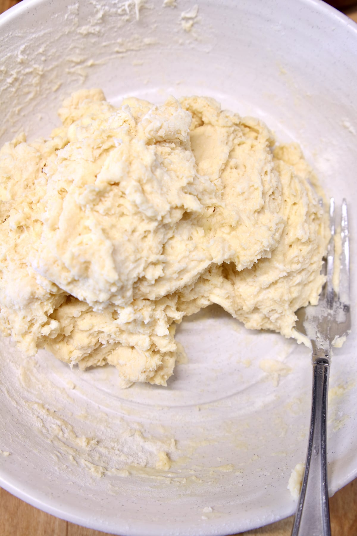 Irish Soda Bread Dough in a bowl with a fork.
