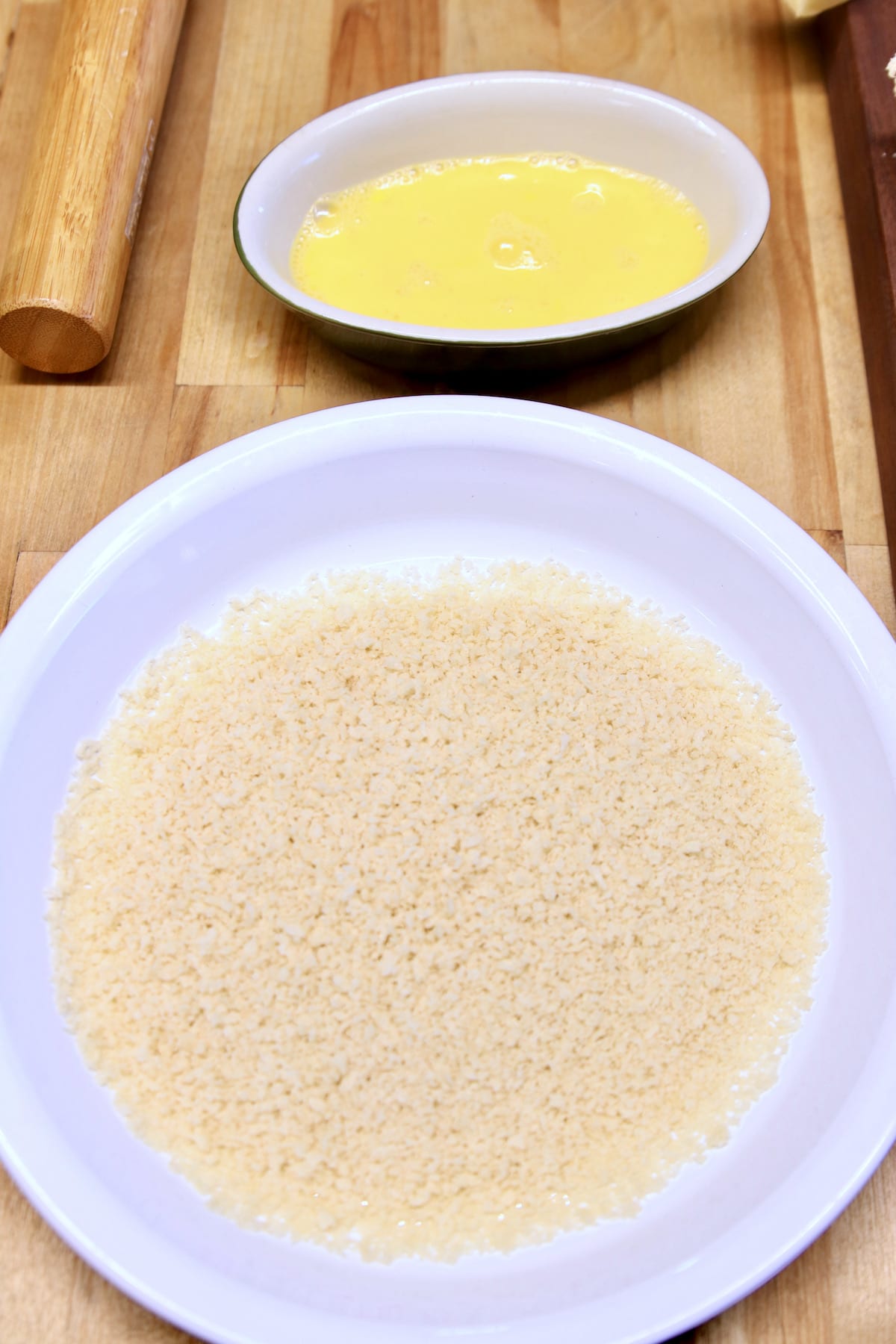 egg wash in a bowl, panko in pie plate.