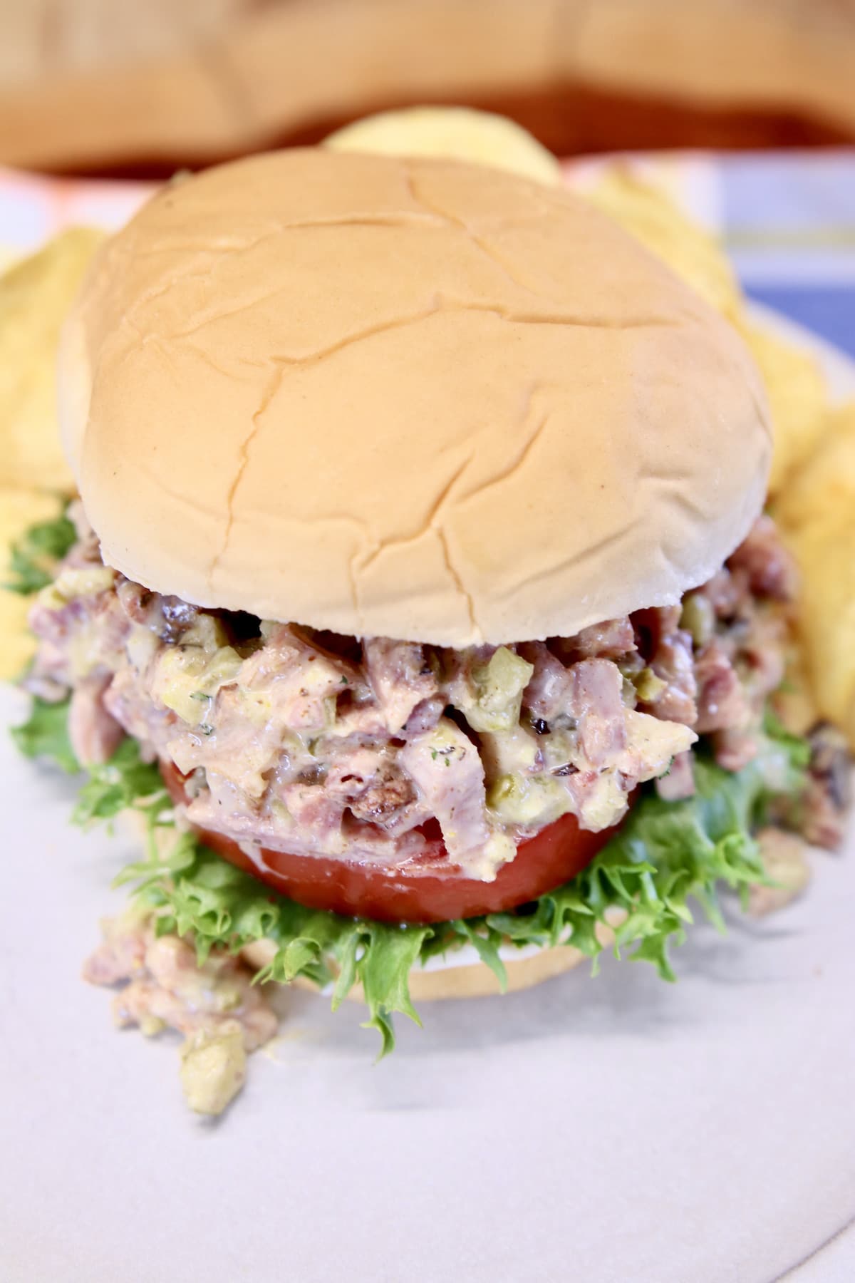 Sandwich with ham salad, lettuce, tomato.