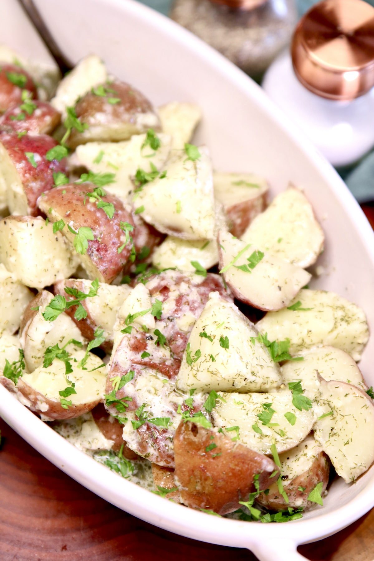 Dish of potatoes with garlic, dill, parsley.