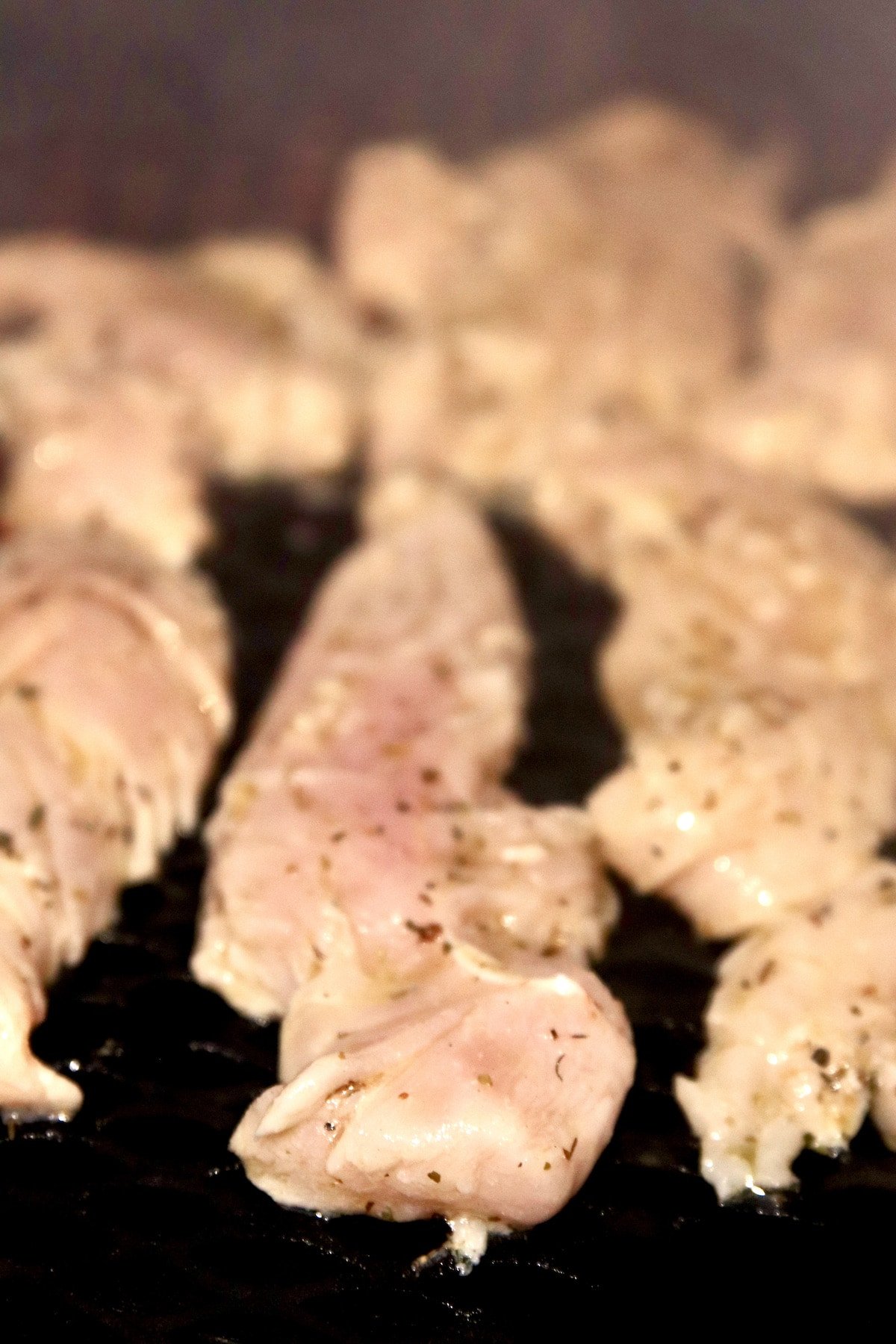 chicken tenders on a grill.