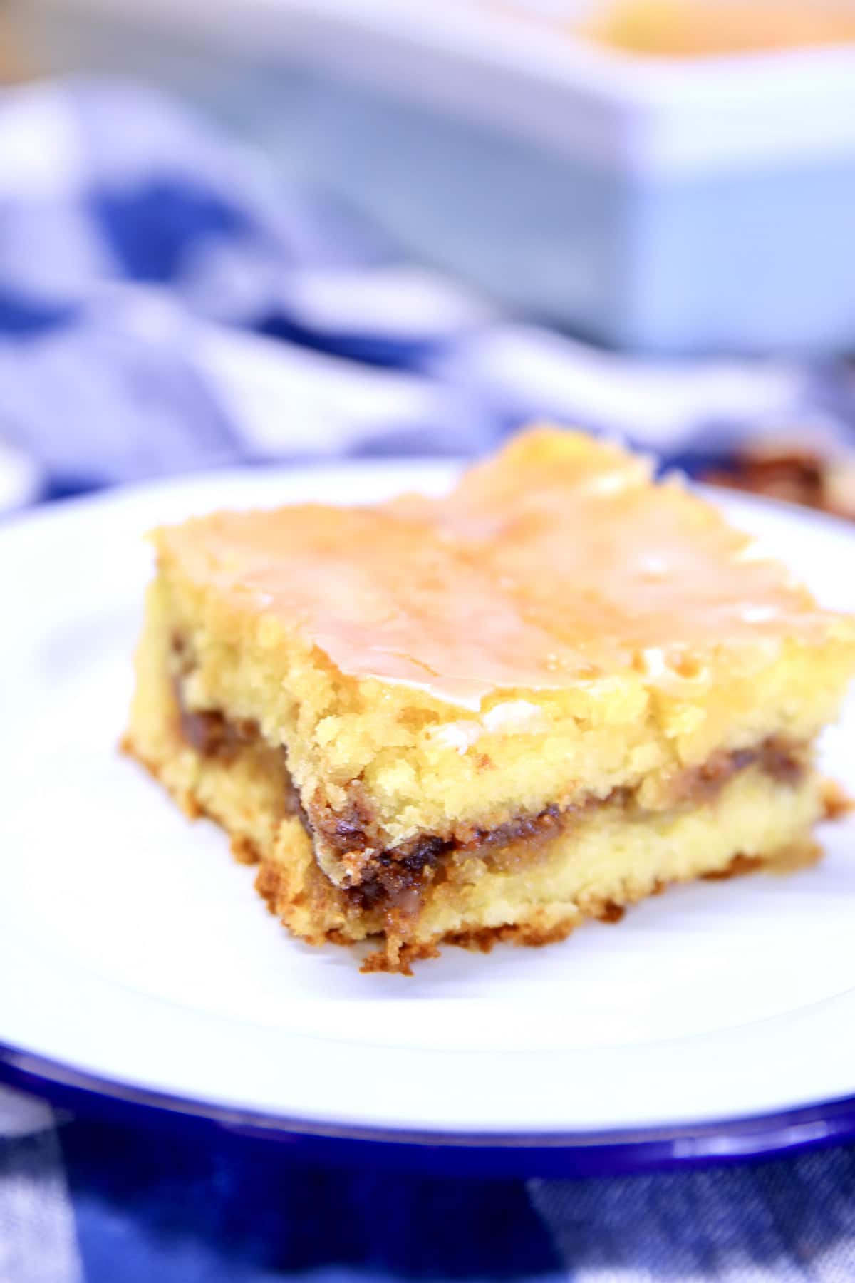 slice of honey bun cake on a plate.