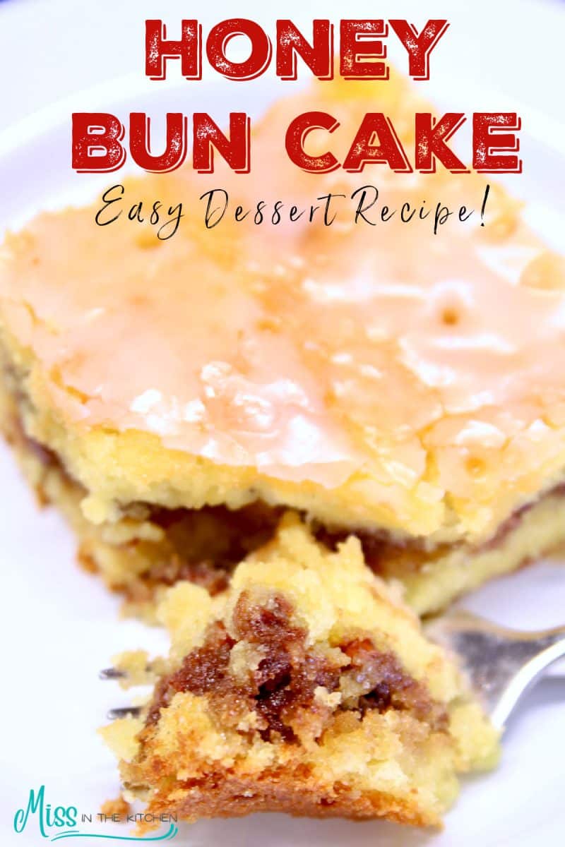 Slice of honey bun cake with bite on a fork.