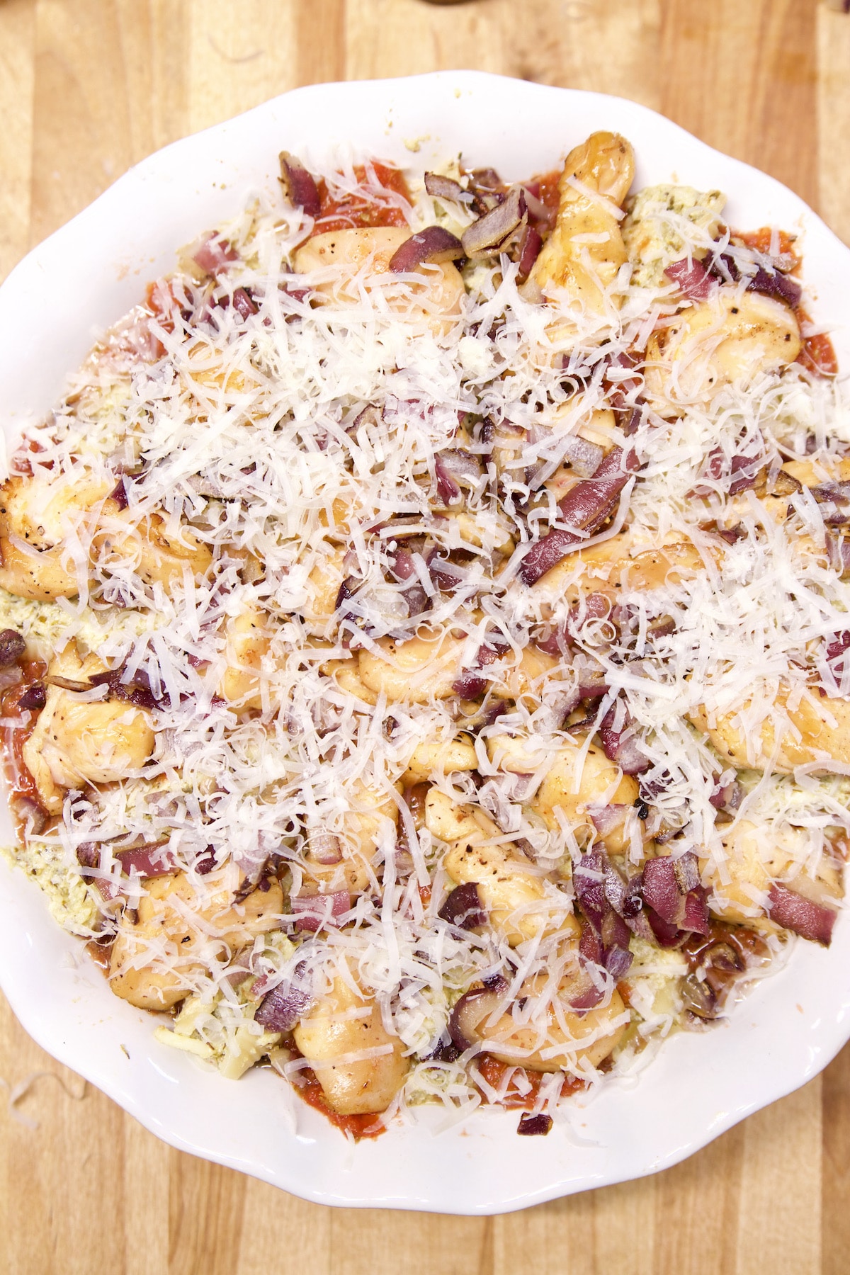 Round casserole dish with stuffed pasta shells.