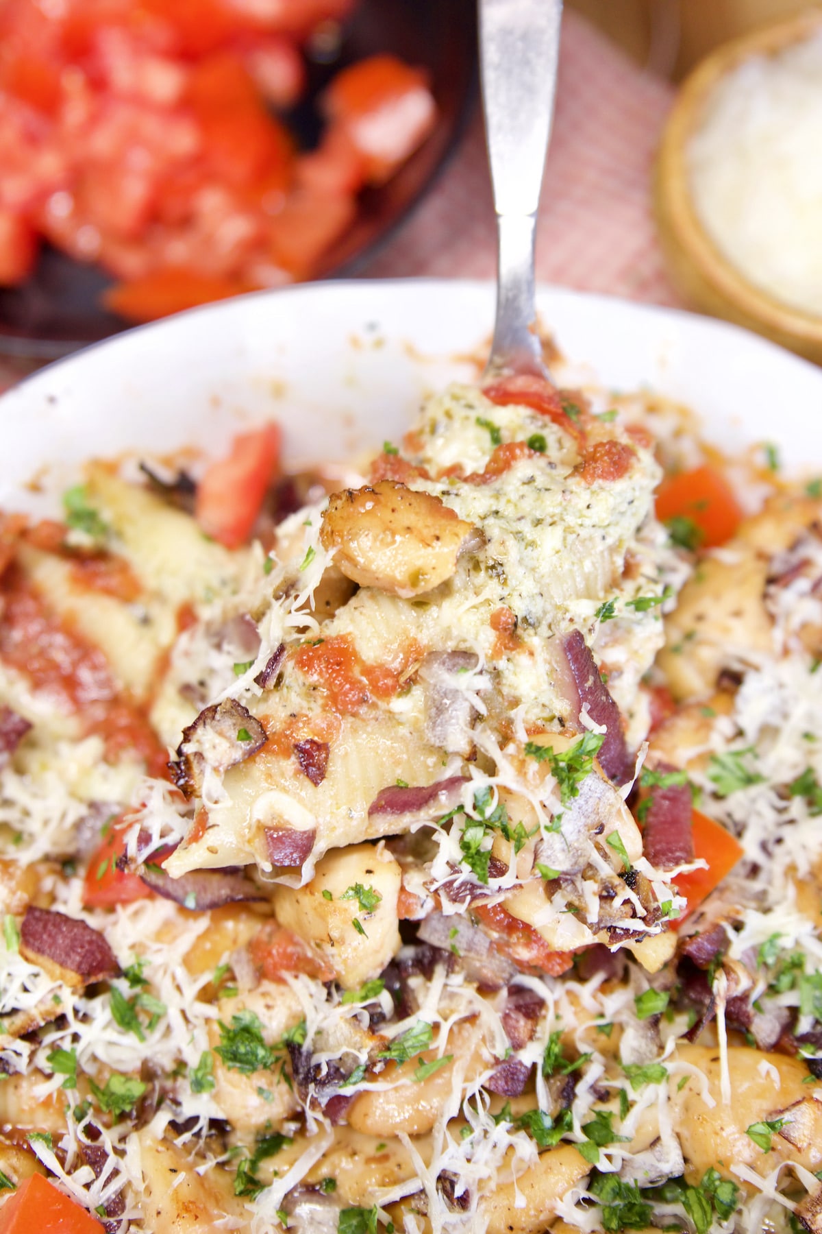 Spoon of chicken stuffed shells.