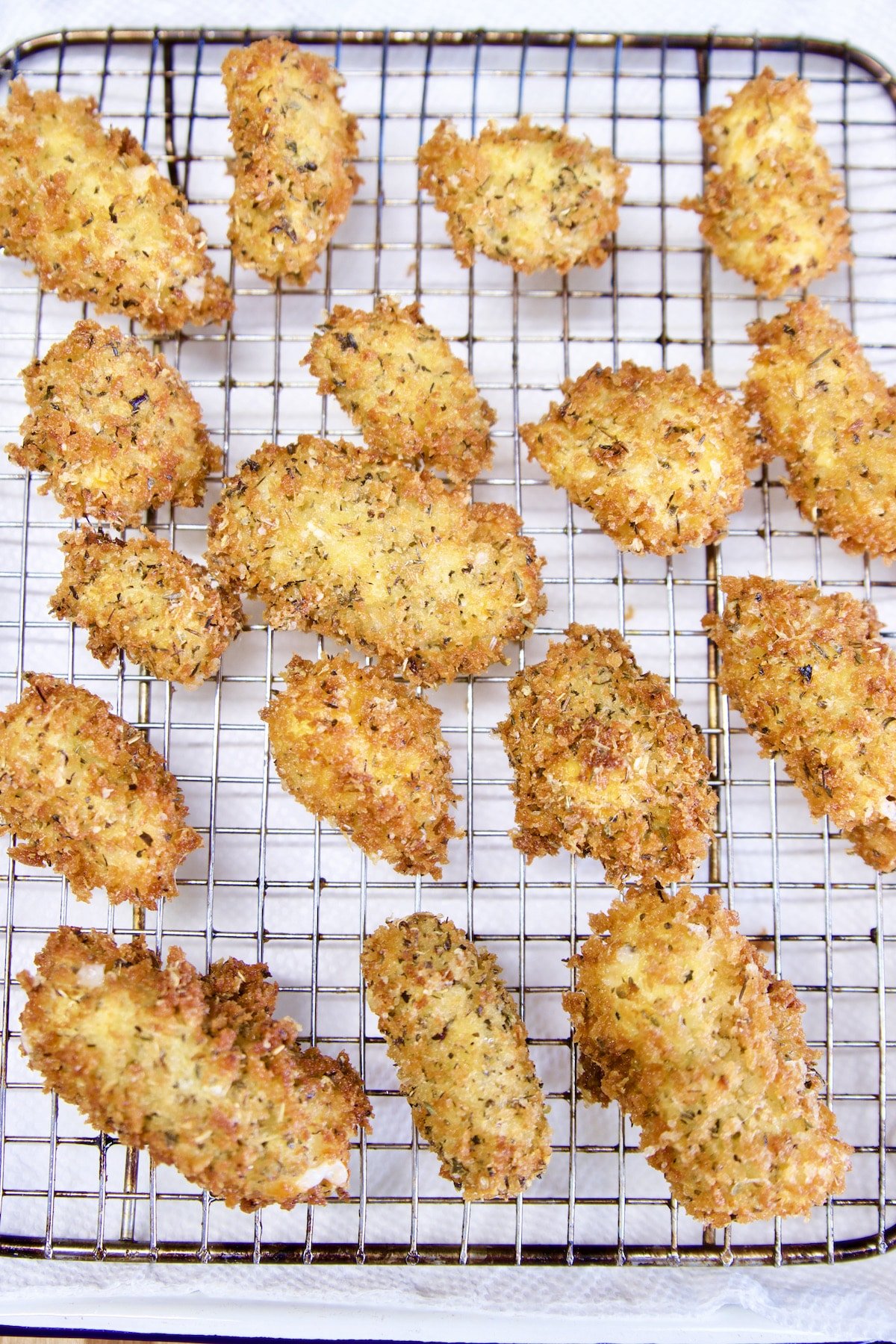 Fried Cheese curds on a wire rack.