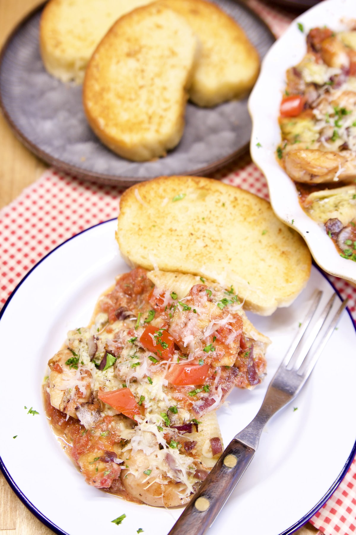 Plate of pasta shells with garlic bread.