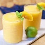 Peach Daiquiris with peach and mint garnish