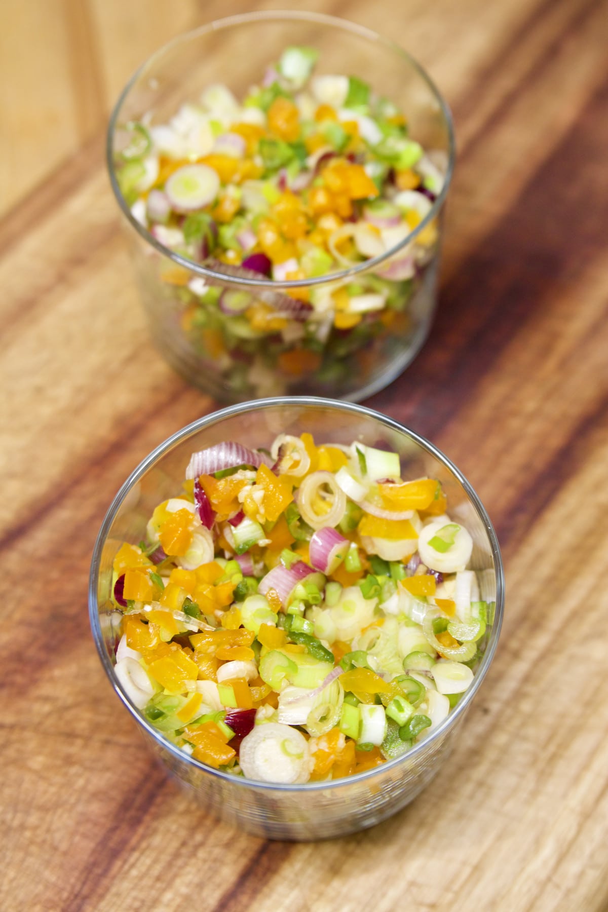 Sliced onions, peppers in 2 jars for relish.