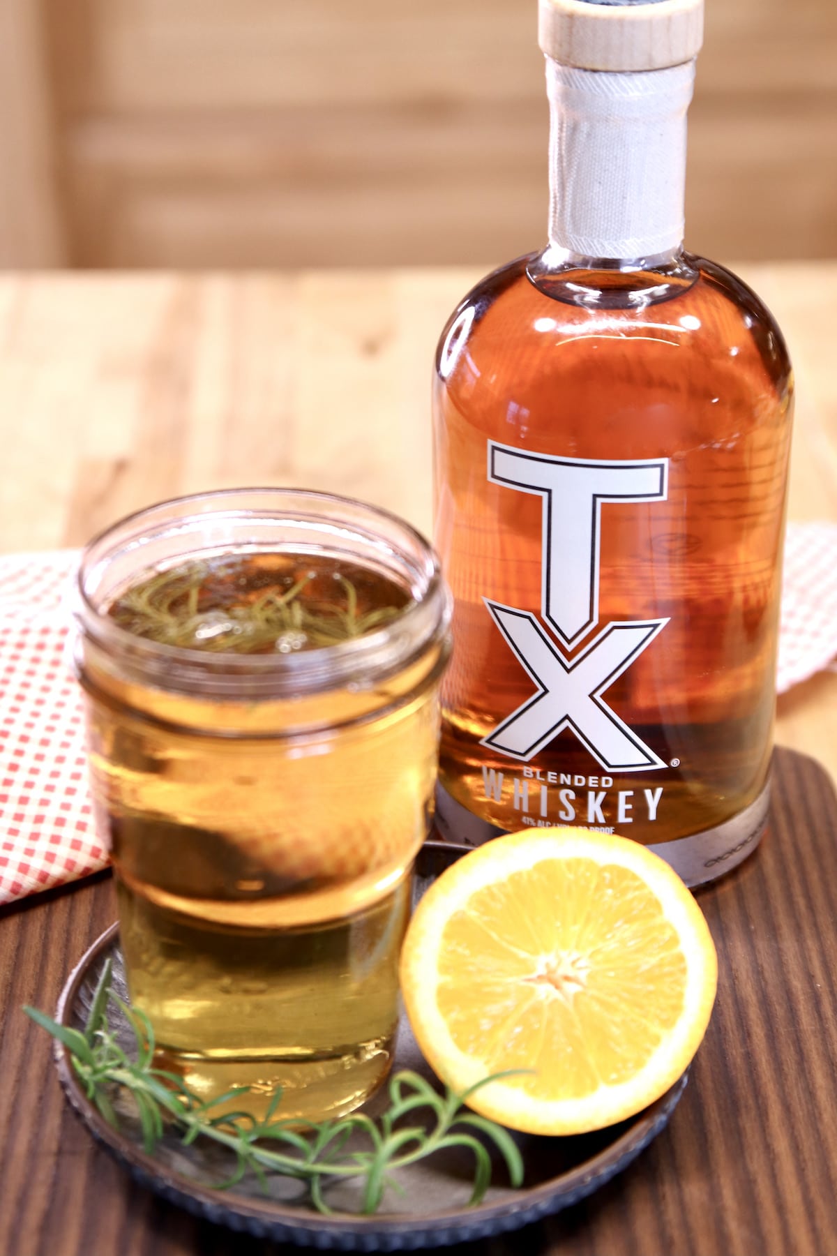 Smoked simple syrup, TX whiskey, half orange, sprig of rosemary.