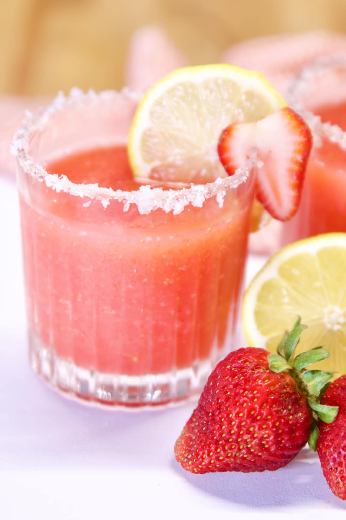 Glass of strawberry tequila cocktail.