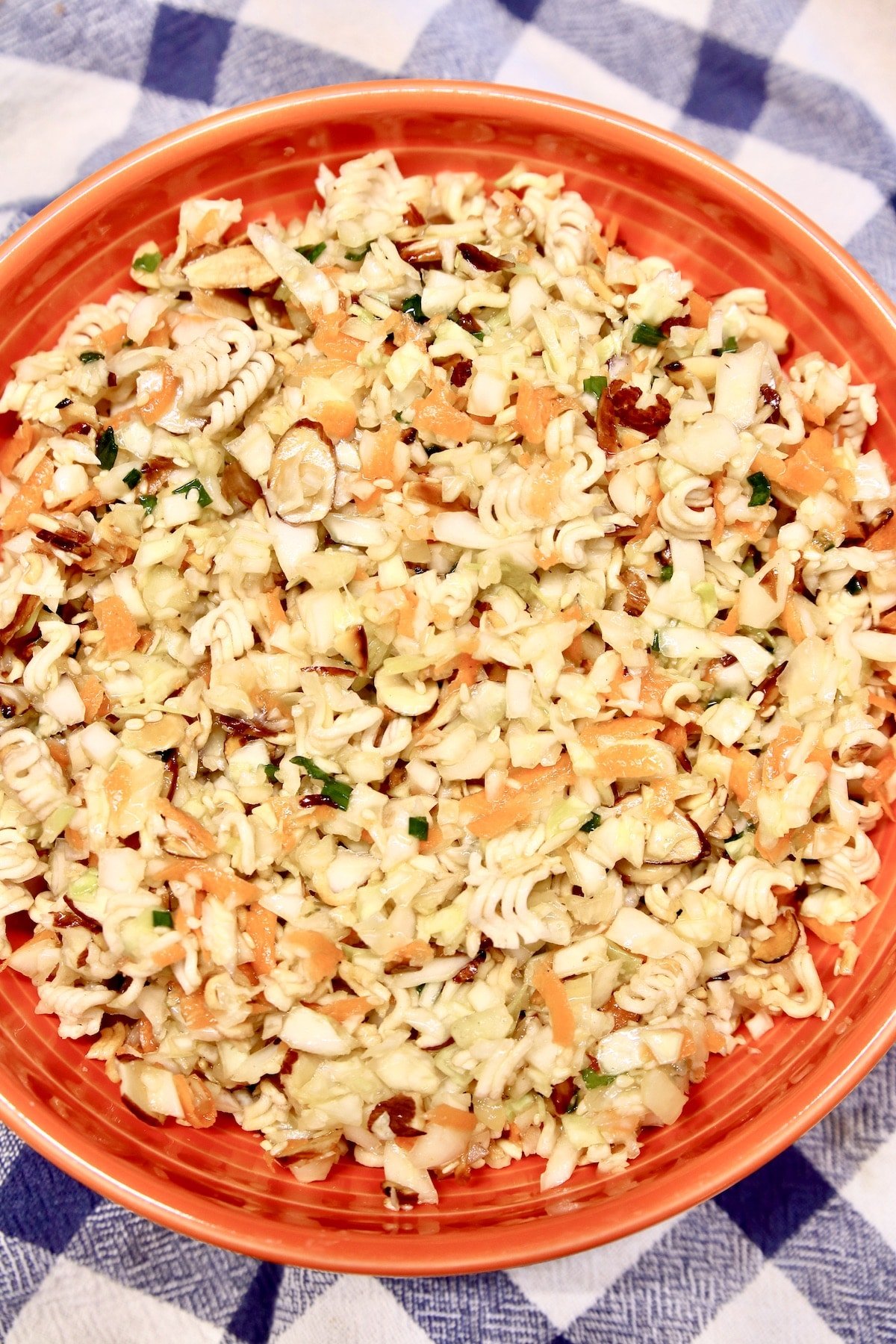 Ramen Salad in an orange bowl.
