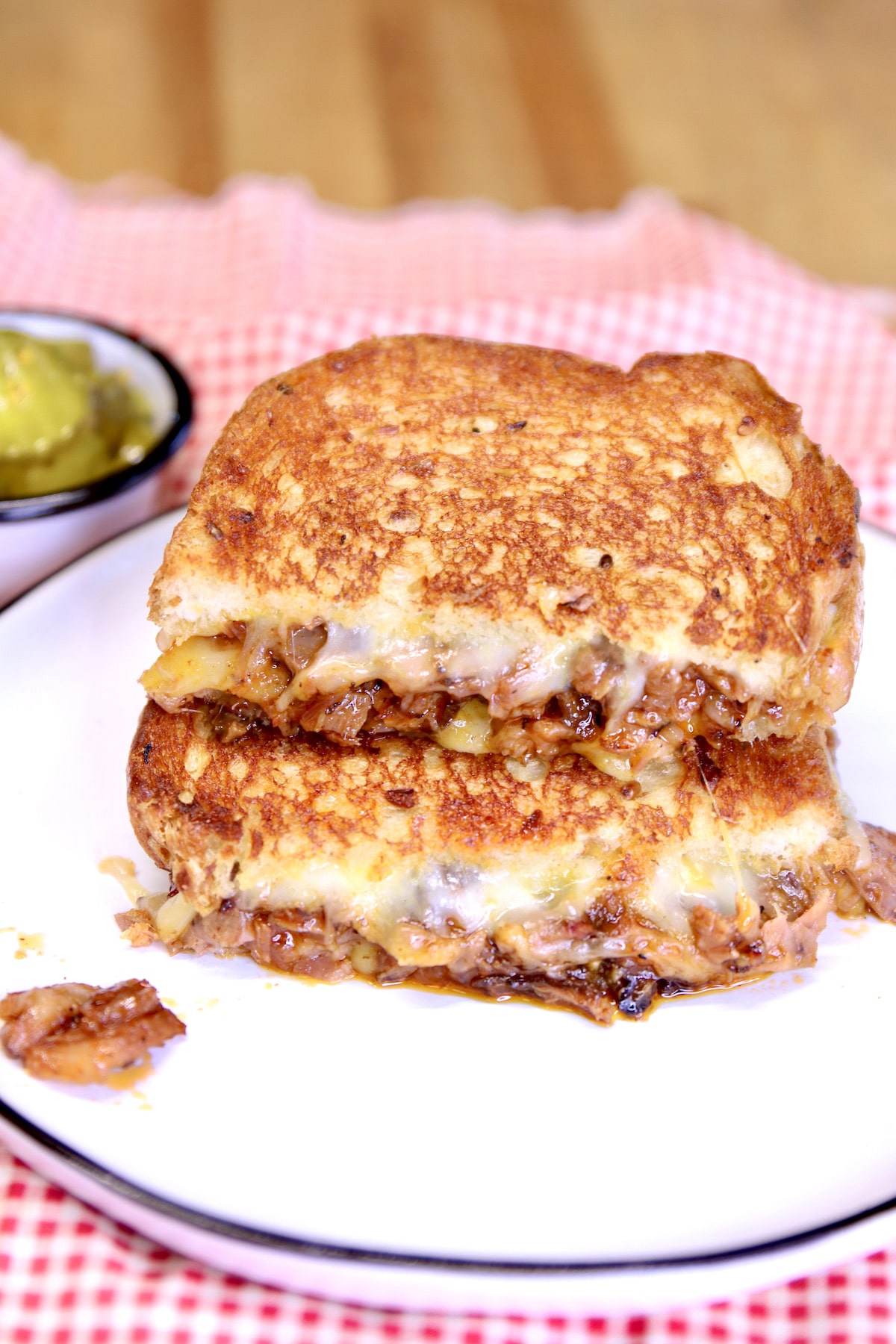 BBQ Brisket grilled cheese sandwich cut in half and stacked.
