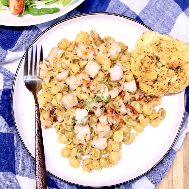 plate of pasta shells with shimp.
